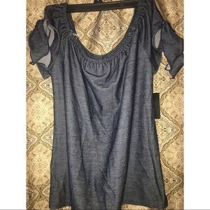 Off the shoulder top with cute shoulder detail.